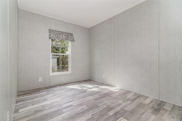 spare room featuring light hardwood / wood-style floors