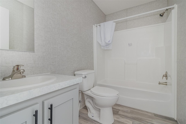 full bathroom featuring vanity, toilet, shower / tub combo, and wood-type flooring