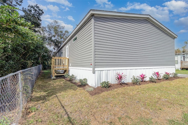 view of home's exterior with a yard