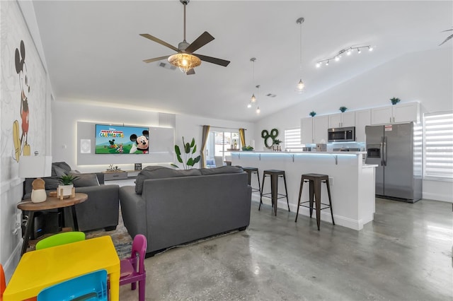 living room featuring ceiling fan and high vaulted ceiling