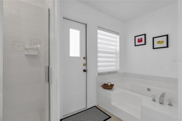 bathroom with separate shower and tub