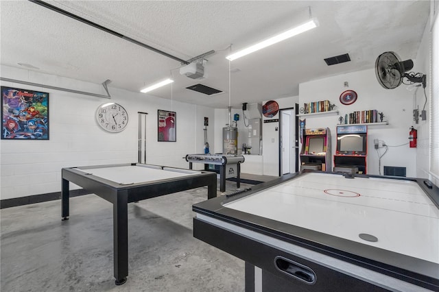 rec room featuring billiards, a textured ceiling, and gas water heater