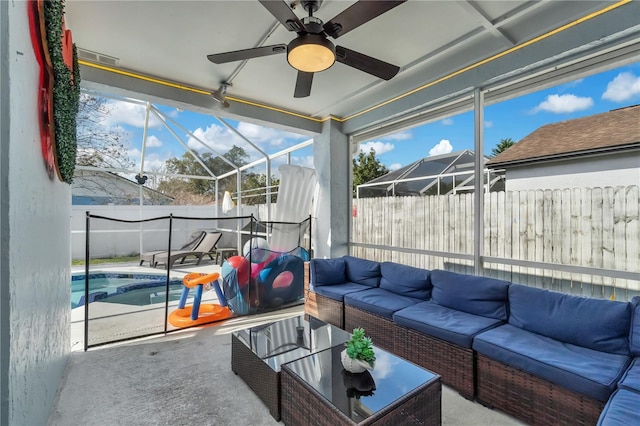 sunroom with ceiling fan