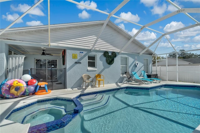 view of swimming pool with an in ground hot tub, ceiling fan, a lanai, and a patio