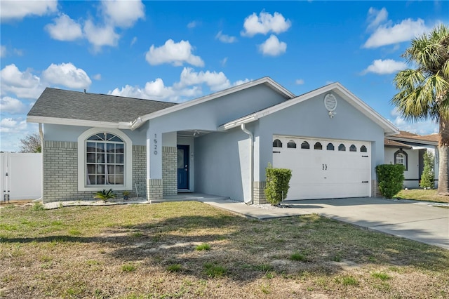 ranch-style home with a garage and a front lawn