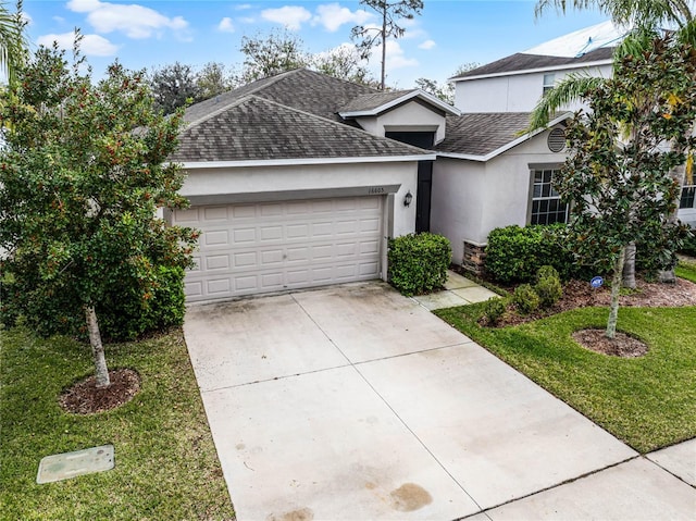 view of front of home with a garage and a front yard