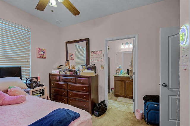 bedroom featuring light carpet and ceiling fan