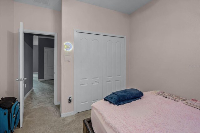 carpeted bedroom with a closet