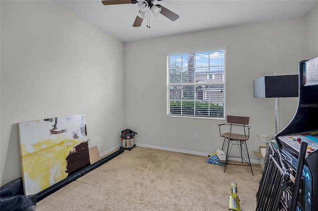 miscellaneous room featuring ceiling fan and light colored carpet