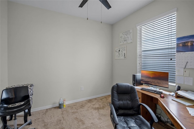 carpeted home office with ceiling fan