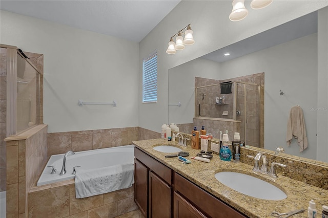 bathroom featuring vanity and independent shower and bath