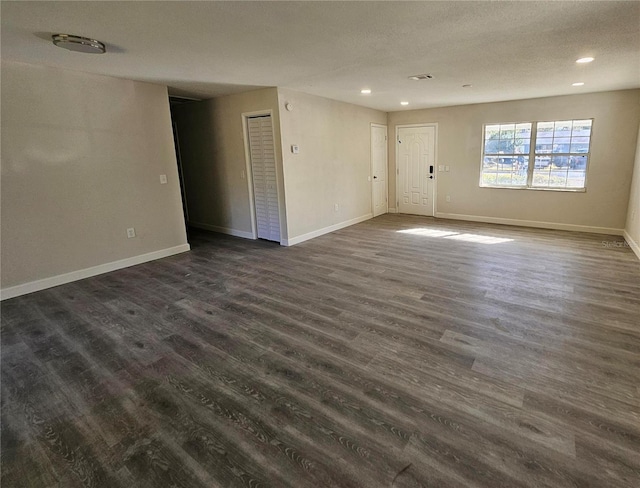 unfurnished room featuring dark hardwood / wood-style floors