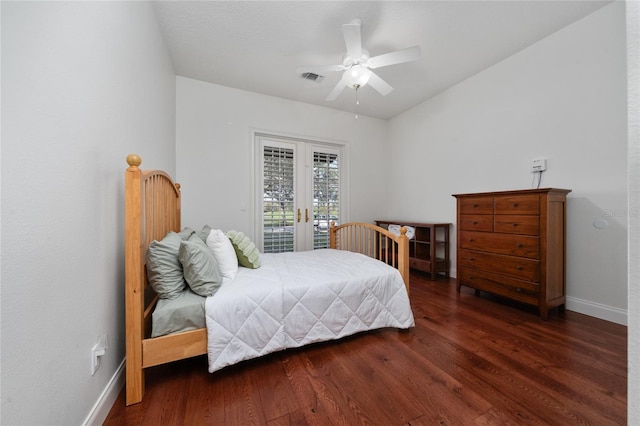 bedroom with access to exterior, dark hardwood / wood-style floors, ceiling fan, and french doors