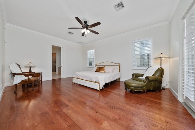 bedroom with crown molding, ceiling fan, and hardwood / wood-style floors