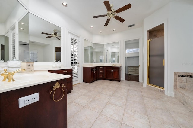 bathroom featuring vanity, ceiling fan, an enclosed shower, and tile patterned floors