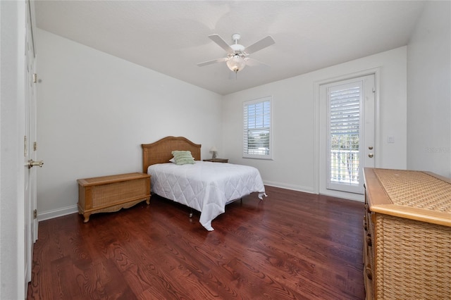 bedroom with dark hardwood / wood-style floors, access to outside, and ceiling fan