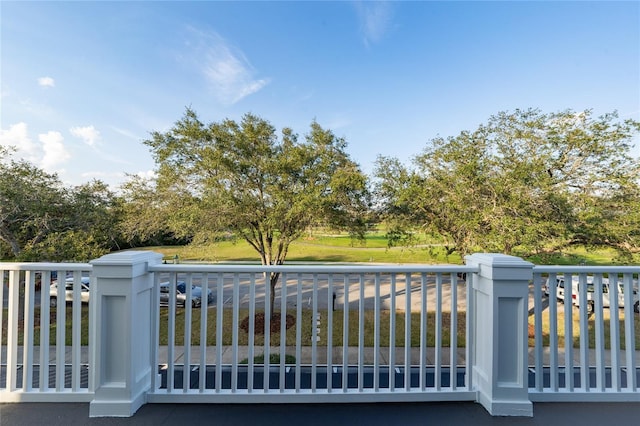 view of gate with a yard