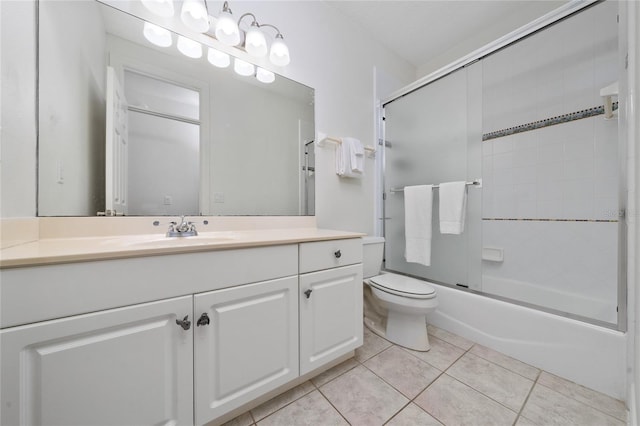 full bathroom with tile patterned flooring, vanity, enclosed tub / shower combo, and toilet