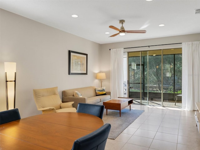 living room with a ceiling fan, light tile patterned flooring, visible vents, and recessed lighting