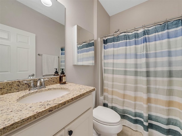 bathroom featuring toilet, a shower with shower curtain, and vanity