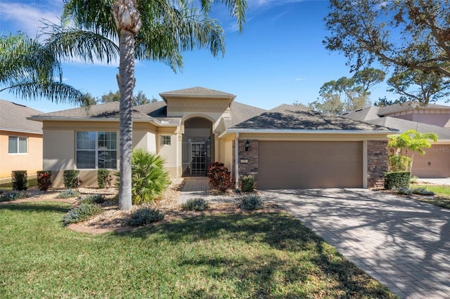 view of front of house with a front lawn and a garage