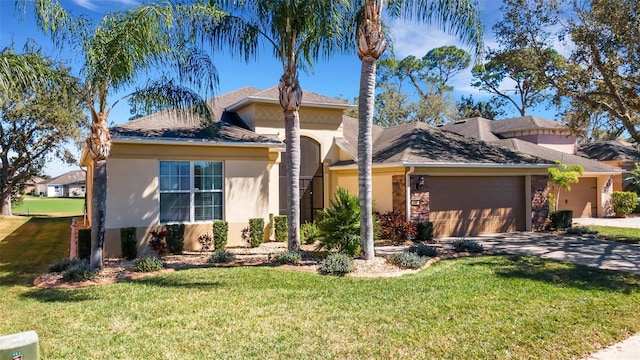 view of front of home featuring a garage and a front yard