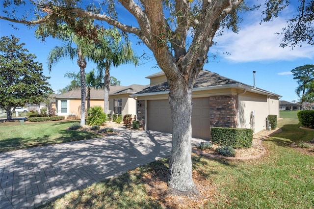 single story home with a front lawn and a garage