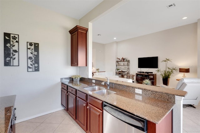 kitchen featuring sink, kitchen peninsula, light stone counters, and dishwasher