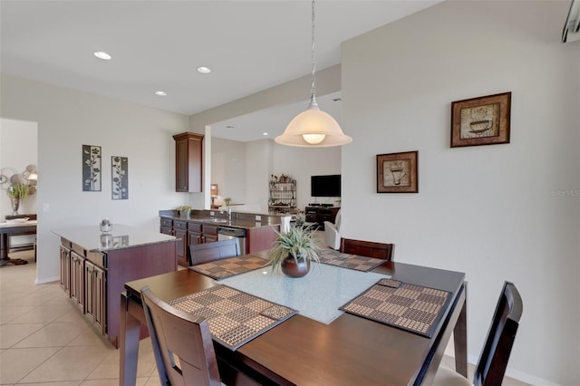 dining room with light tile patterned floors and sink