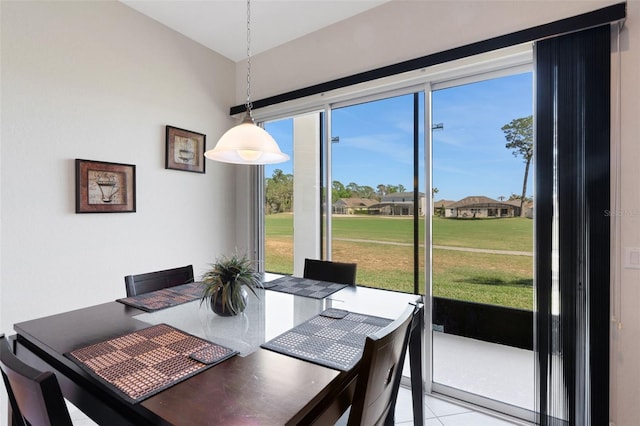 dining area featuring light tile patterned flooring