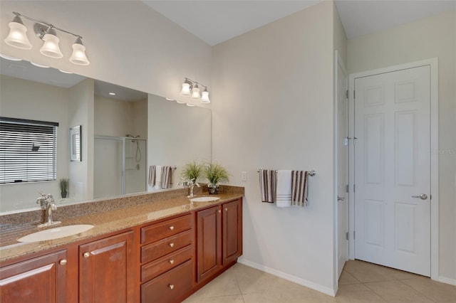 bathroom featuring tile patterned floors, vanity, and a shower with door