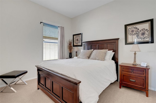 bedroom with light colored carpet