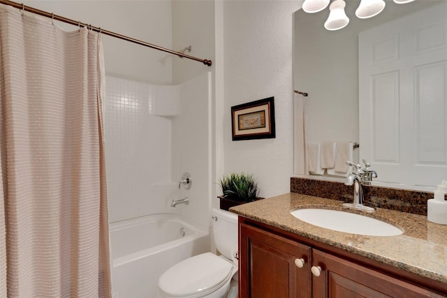 full bathroom with shower / tub combo with curtain, vanity, and toilet