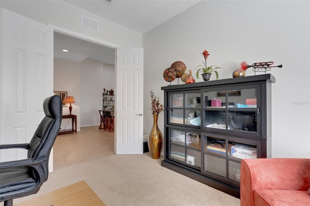 home office with carpet flooring and lofted ceiling