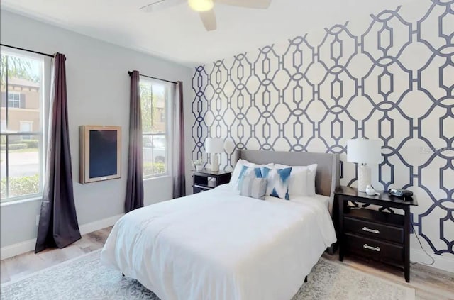 bedroom featuring ceiling fan and light hardwood / wood-style flooring