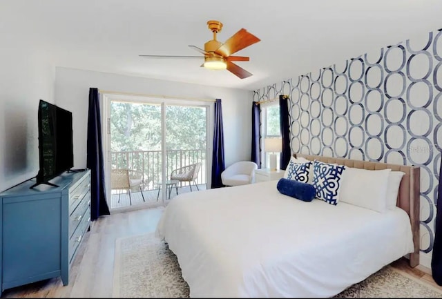 bedroom featuring access to outside, light hardwood / wood-style floors, and ceiling fan