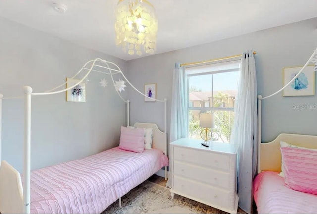 bedroom featuring an inviting chandelier