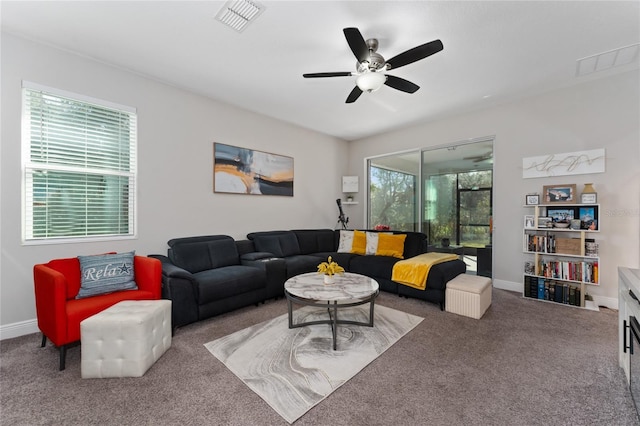 living room featuring ceiling fan and carpet flooring