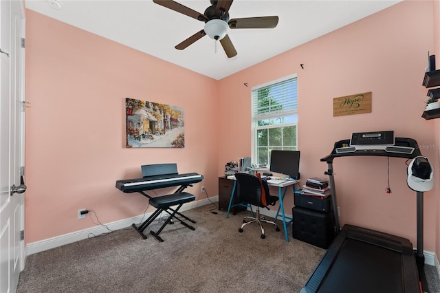 carpeted office space featuring ceiling fan