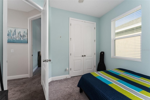 carpeted bedroom featuring a closet