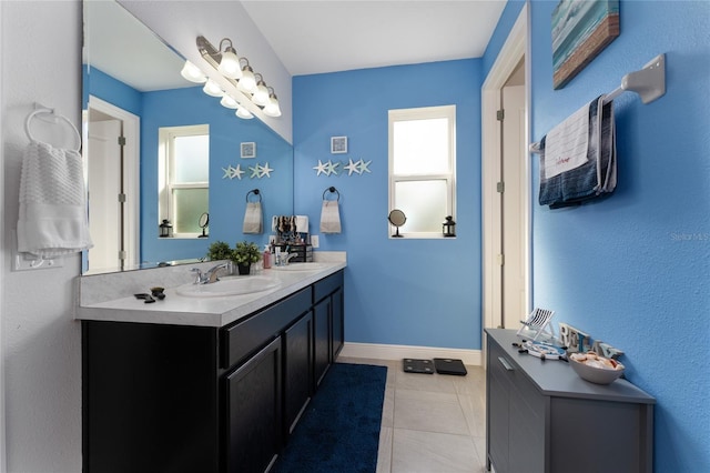 bathroom with tile patterned floors and vanity