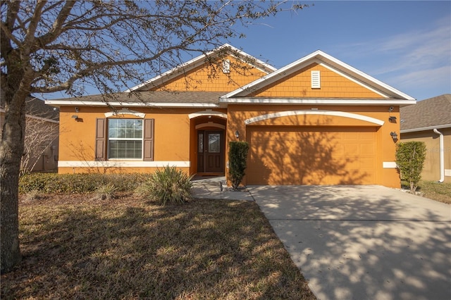 view of front facade featuring a garage and a front lawn