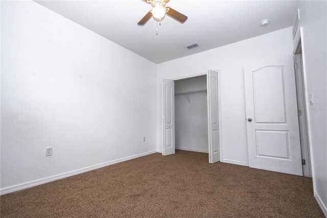 unfurnished bedroom with a closet, ceiling fan, and carpet