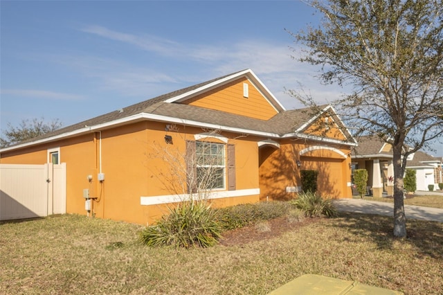 view of home's exterior with a lawn