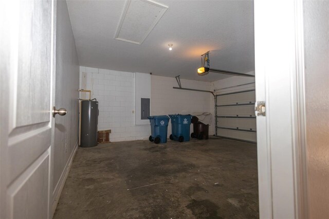 garage featuring water heater, a garage door opener, and electric panel