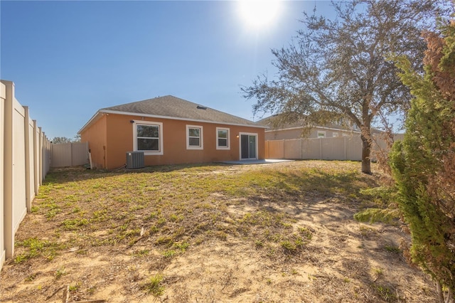 rear view of house with central AC