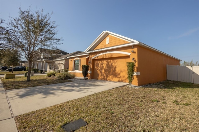 view of front of house featuring a garage and a front yard