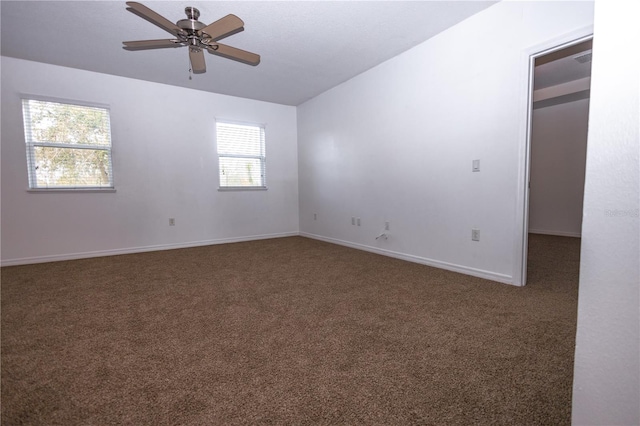 carpeted empty room featuring ceiling fan