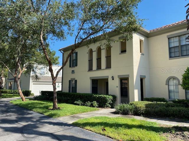 mediterranean / spanish-style house with a front lawn