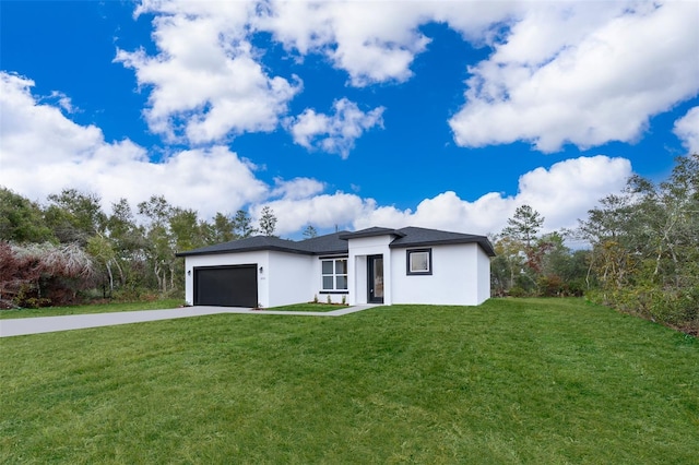 view of front facade featuring a garage and a front lawn